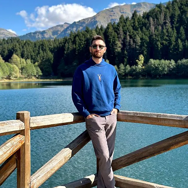 Dr Eren by a mountain lake