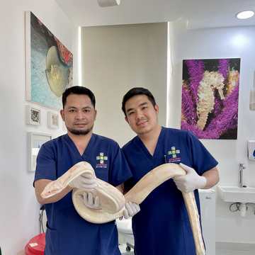 Two of the team with a python