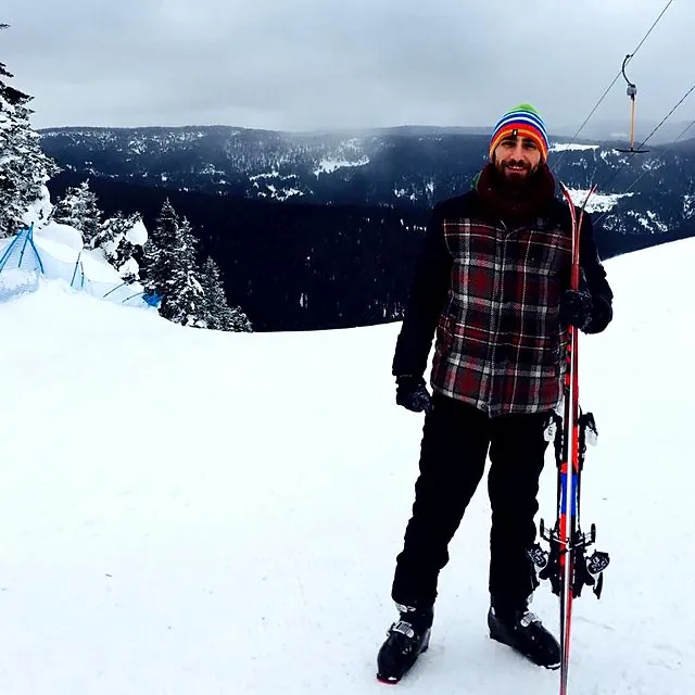 Dr Eren skiing in the mountains