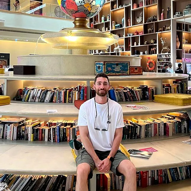Dr Eren in a bookshop courtyard