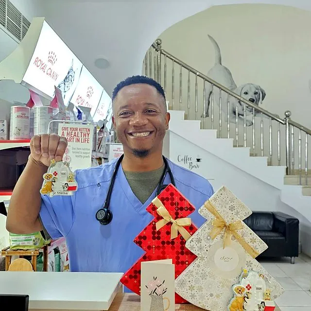 Dr Tinashe at reception with festive gifts and his name ornament