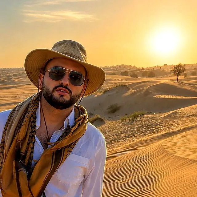 Dr Furkan in the desert at sunset