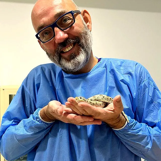 Dr Piotr holding a hognose snake